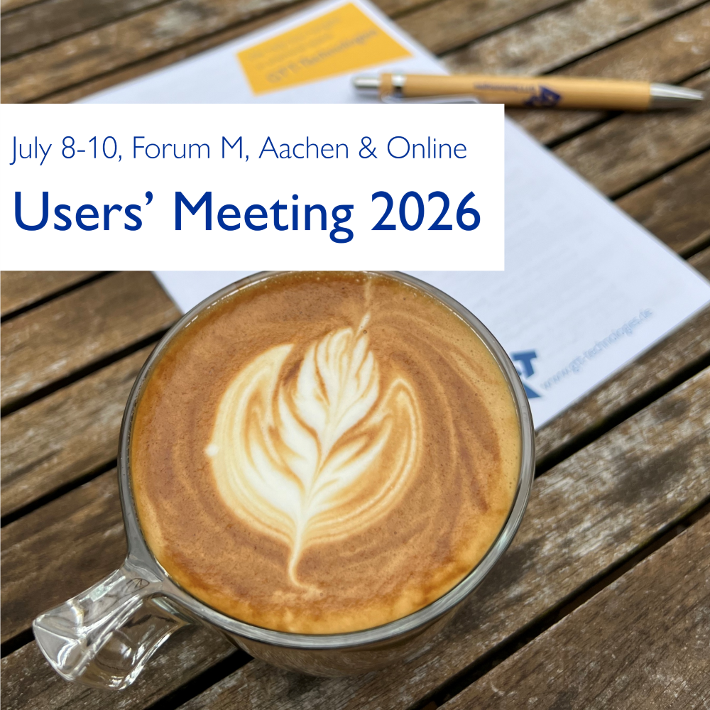 A close-up of a cappuccino with latte art on a wooden table, with a blurred conference booklet and pen in the background, highlighting the Users’ Meeting 2026 event in Aachen and online.